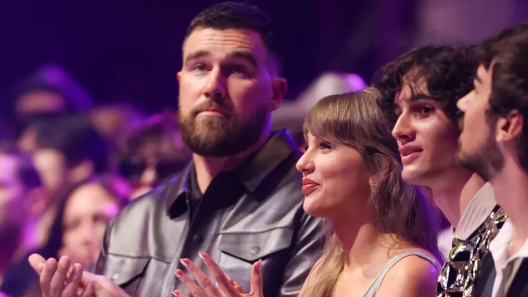 Taylor Swift and Travis Kelce’s exchange revealed by lip reader as they make award show debut