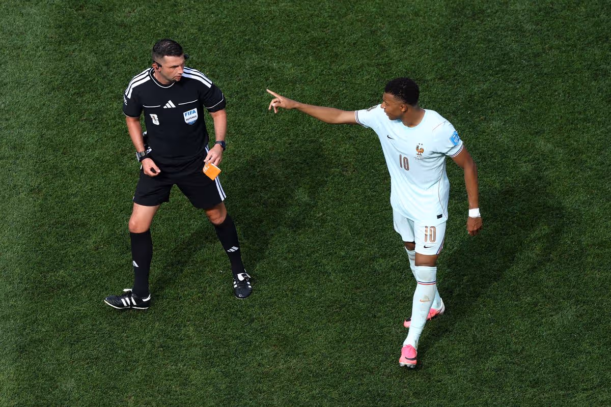 Kylian Mbappe's pointing at referee Michael Oliver