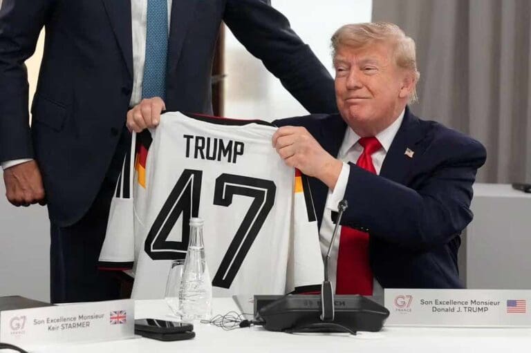 Lip reader spots awkward Donald Trump question after Germany jersey gesture