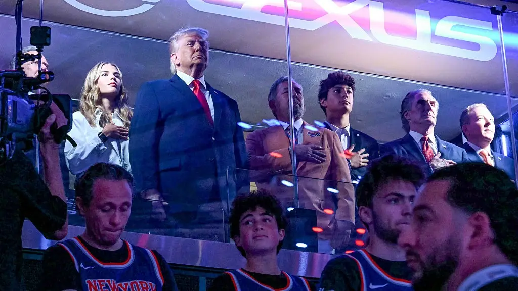 Donald Trump and granddaughter Kai, hand on heart for anthem