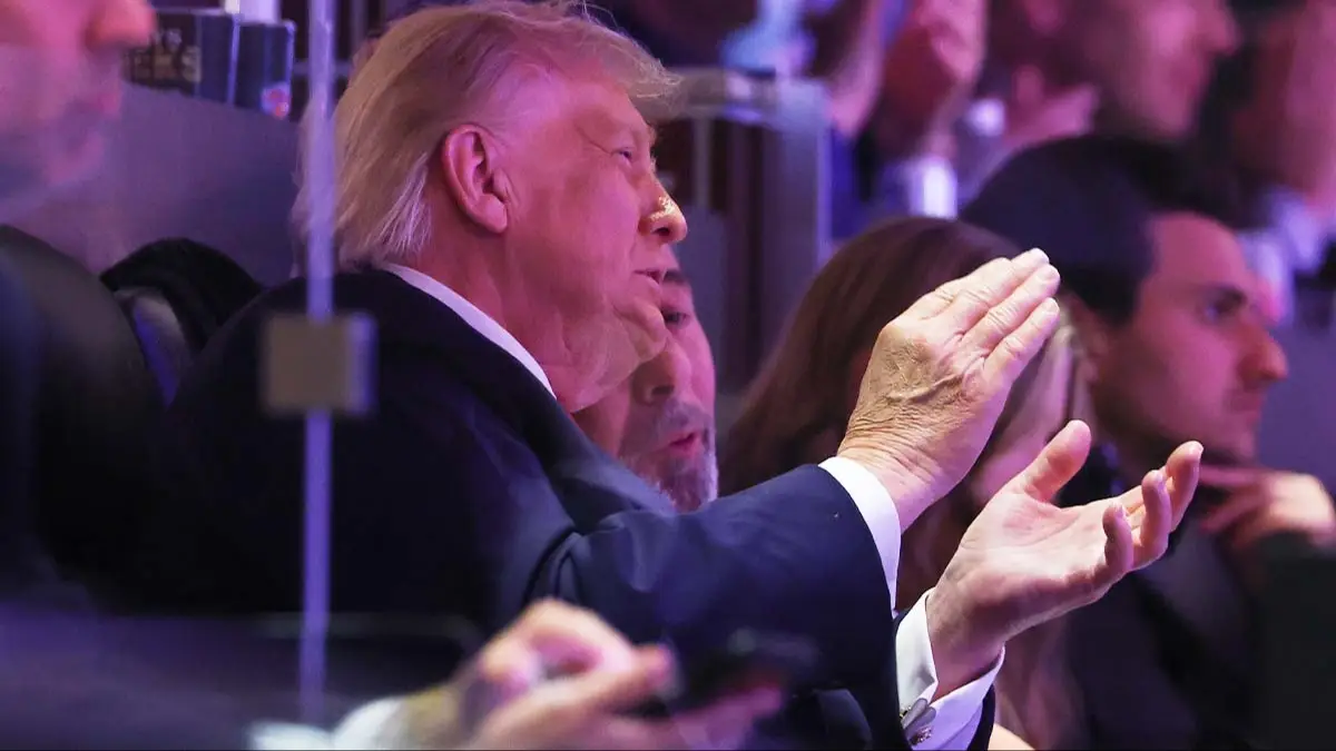 Lipreader spots Trump's 'threat' to fans in secret chat at Knicks game after he was savagely booed